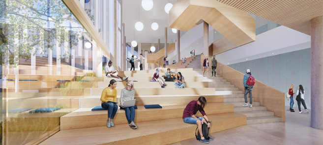 Intérieur d'une école secondaire avec gradins en bois, grande fenestration et aire de rassemblement lumineuse.